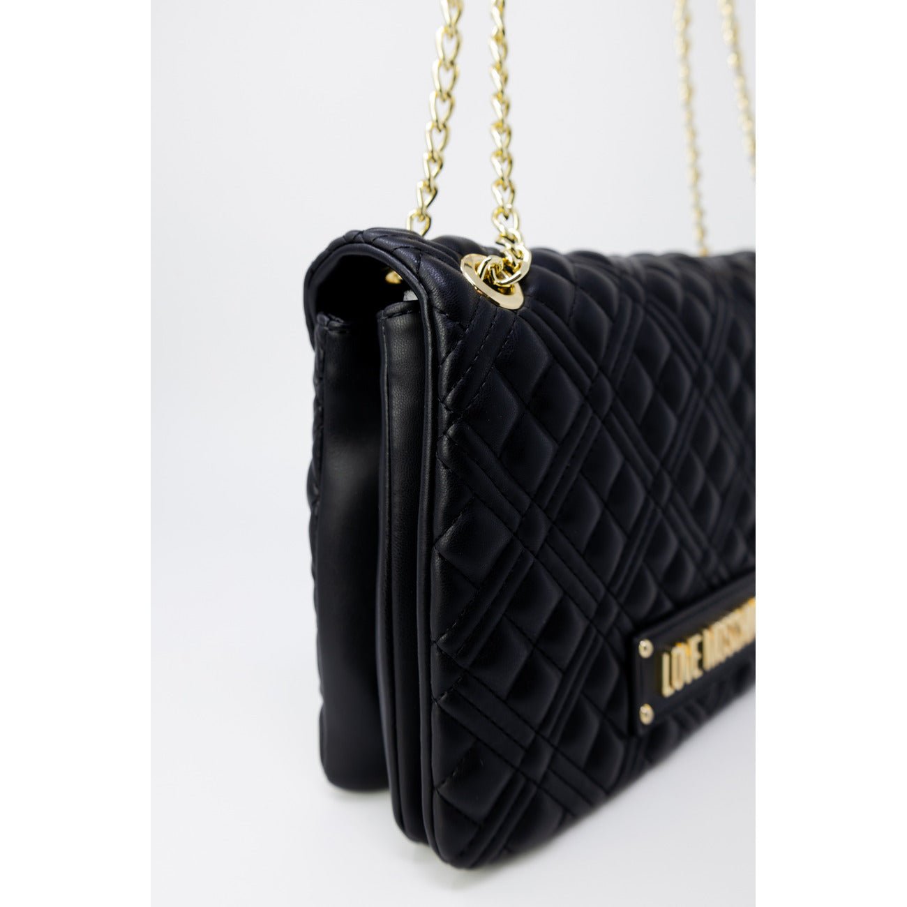Side view of Love Moschino luxury quilted black bag featuring gold chain handles, perfect for stylish occasions.